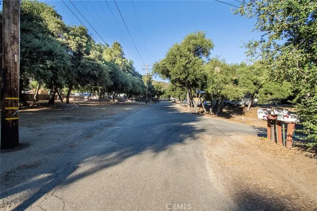 a view of a trees with barn