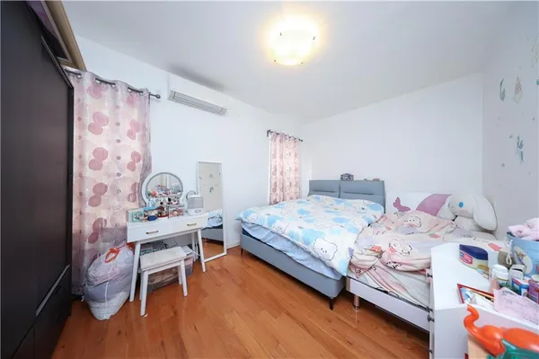 a bedroom with a bed and a table in it