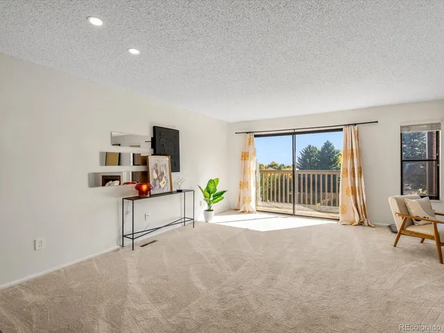 a view of livingroom with furniture and windows