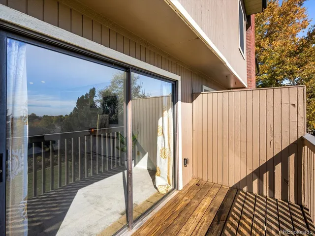 a view of kitchen with furniture and wooden floor