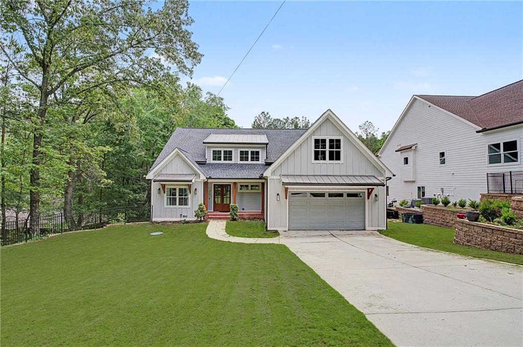 376 Hunnicut Road Southeast Mableton, GA 30126 - Photo 3 of 73 a view of house with garden and tall tress