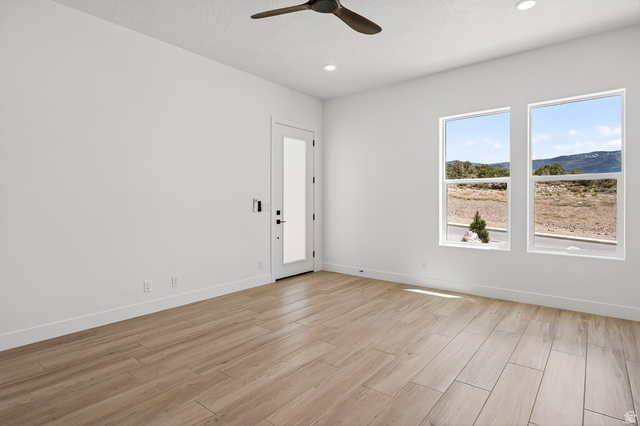 2862 South Mountain Rnch Road Cedar City, UT 84720 - Photo 45 of 64 Bright room with wood-finish flooring and a contemporary ceiling fan