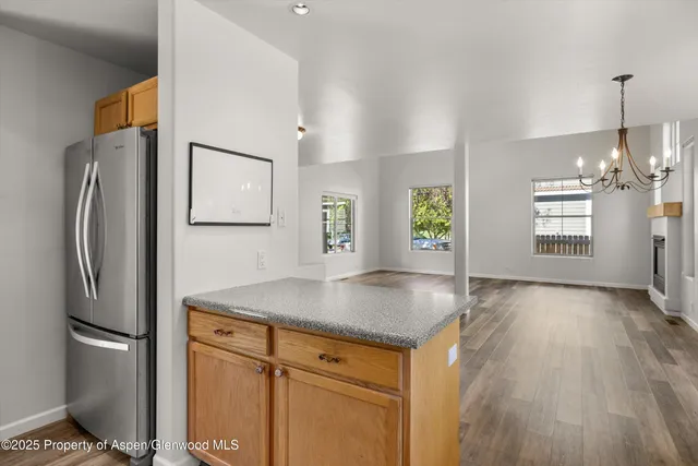 a kitchen with a sink stove and refrigerator