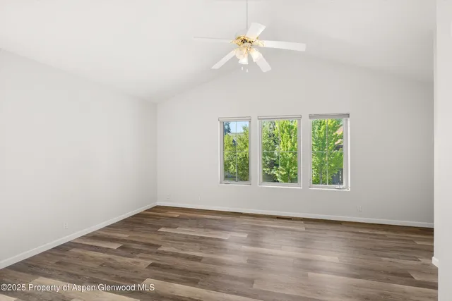 a bathroom with a granite countertop sink mirror and a bathtub