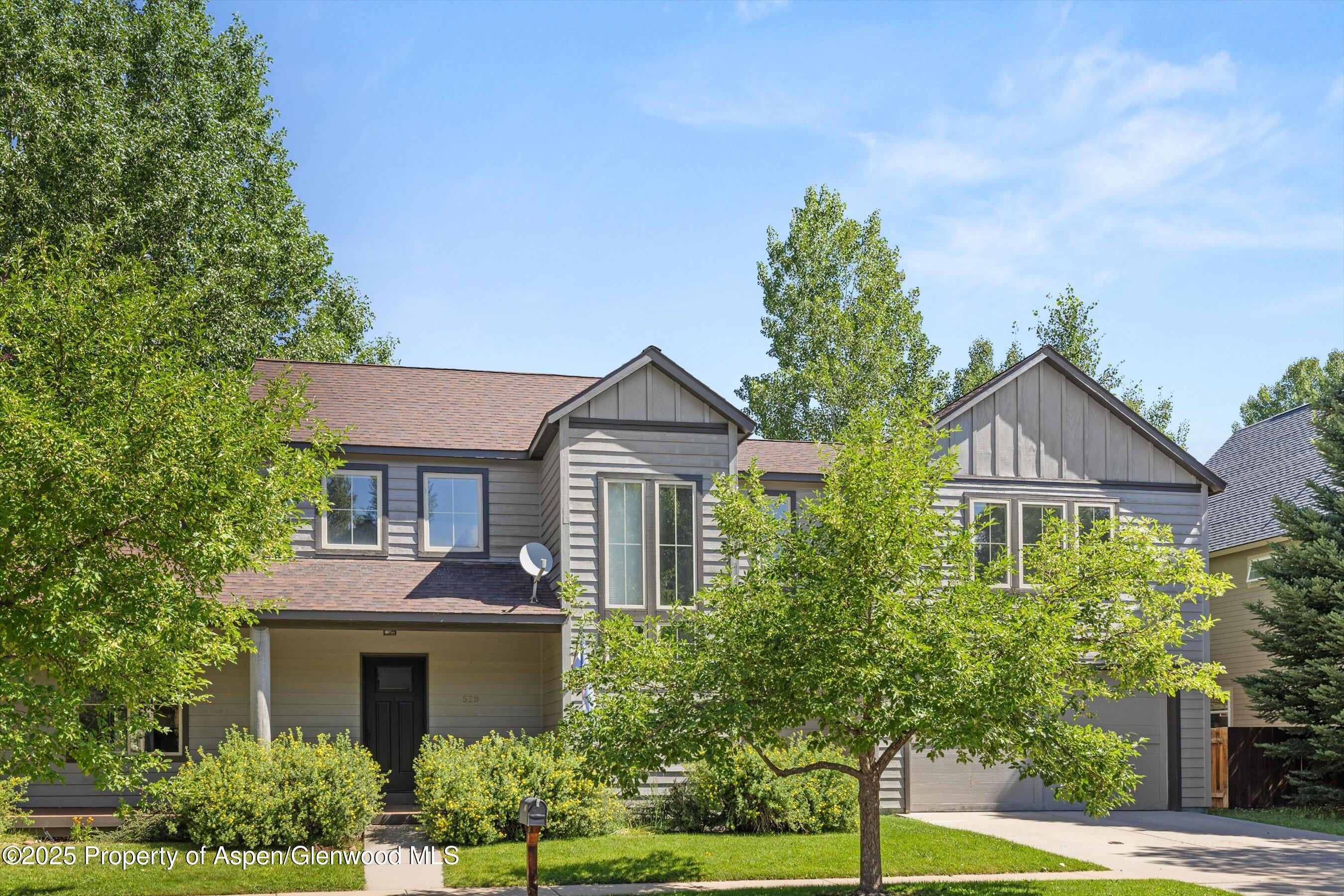 528 Lake Court Basalt, CO 81621 - Photo 28 of 33 a front view of a house with a yard and potted plants