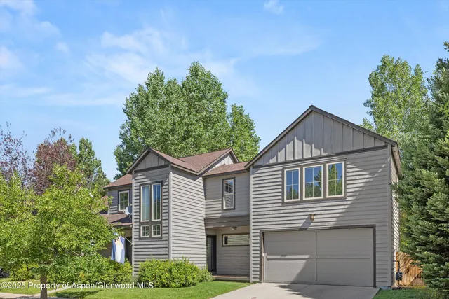 a view of a backyard with potted plants