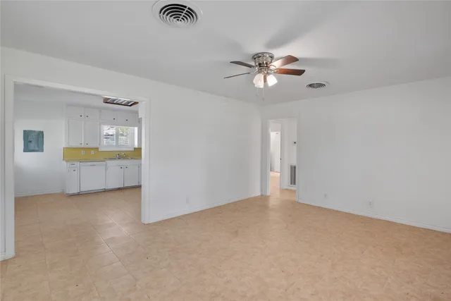 a view of an empty room with a window