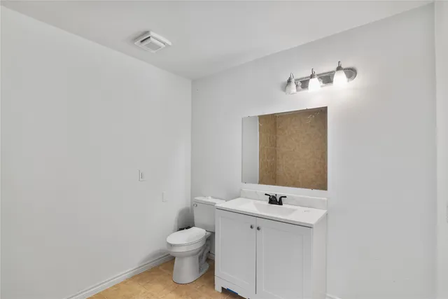 a view of a house with a big yard and potted plants