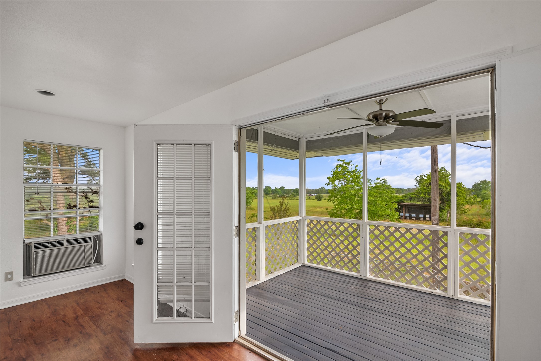 36622 Tompkins Road Hempstead, TX 77445 - Photo 37 of 46 a view of an empty room with wooden floor and windows