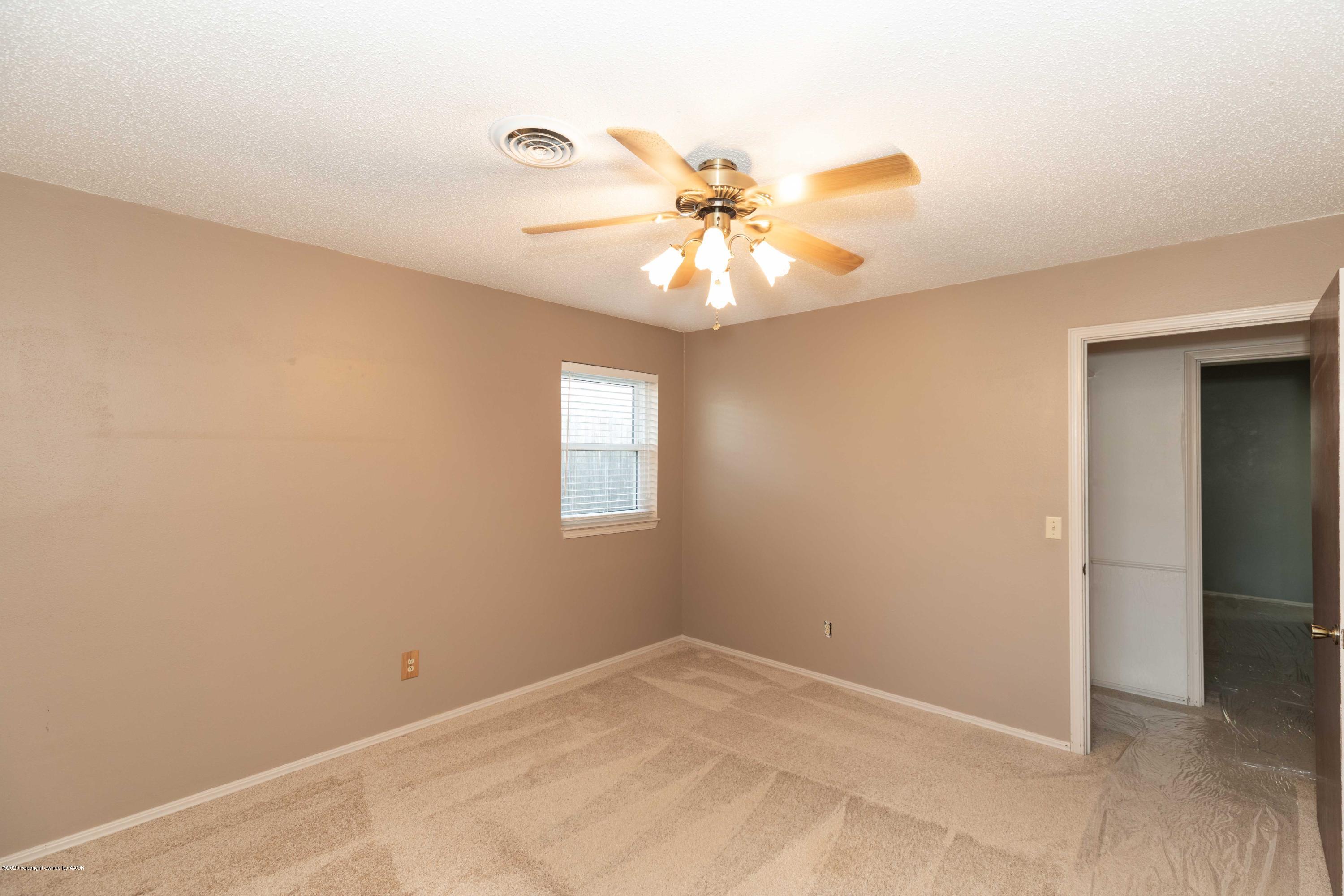 4924 South Georgia Street Amarillo, TX 79110 - Photo 26 of 35 an empty room with windows and fan