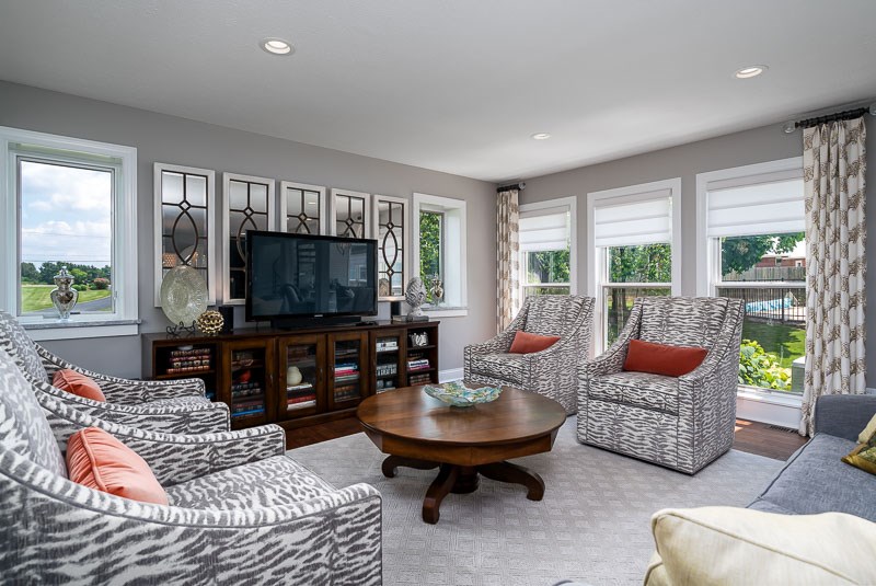 10762 Shaw Road Rockford, IL 61114 - Photo 11 of 25 a living room with furniture and a flat screen tv