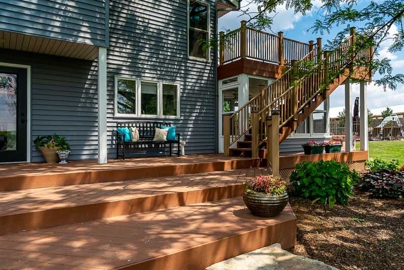 10762 Shaw Road Rockford, IL 61114 - Photo 7 of 25 a view of a patio with couches table and chairs and potted plants