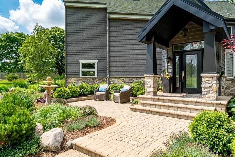 10762 Shaw Road Rockford, IL 61114 - Photo 9 of 25 a view of a house with sitting area and potted plants