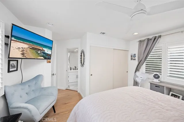 a spacious bedroom with a bed and a couch