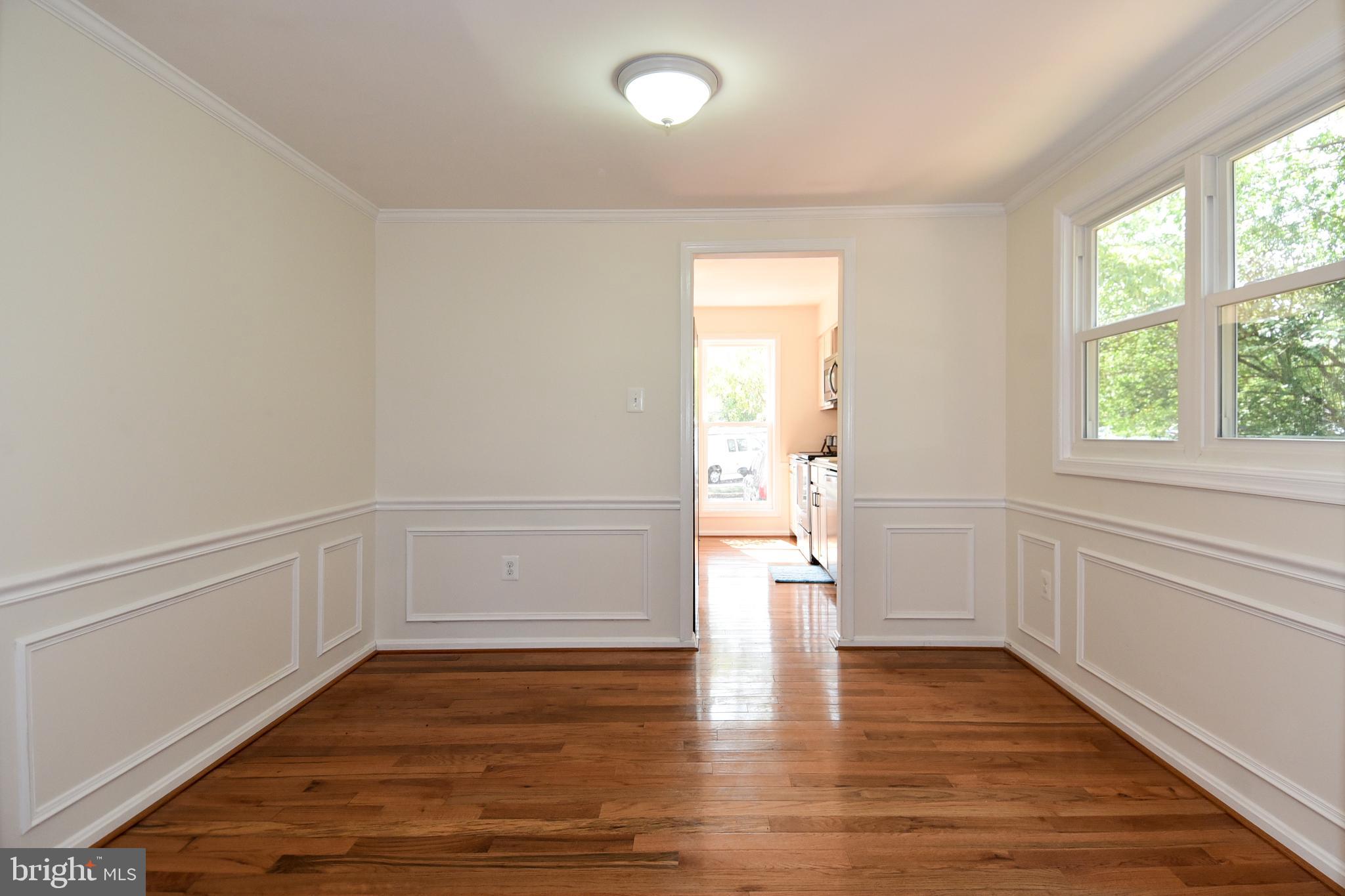 8482 Stonewall Road Manassas, VA 20110 - Photo 12 of 36 Shadow boxing and chair rail in dining