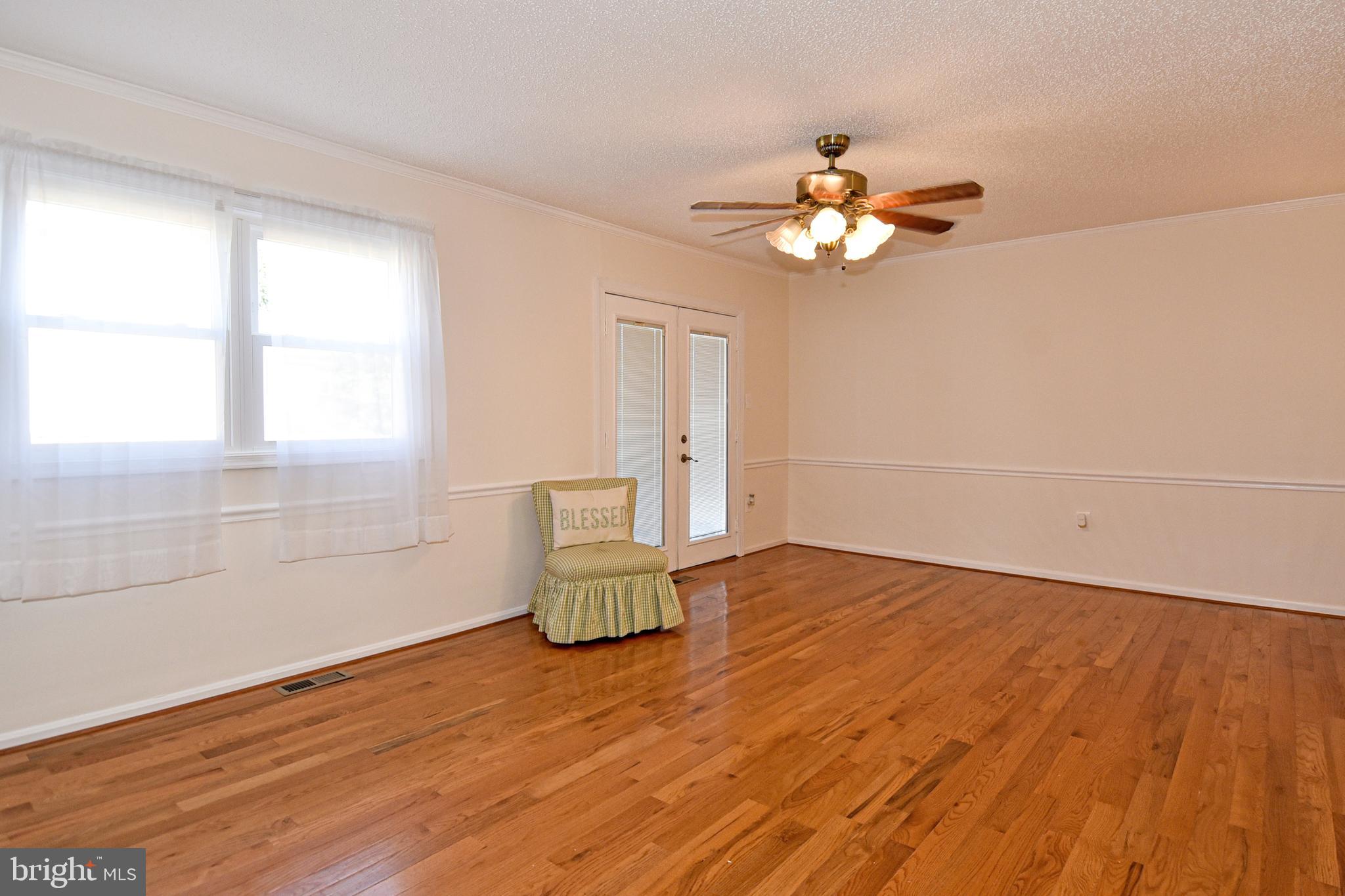 8482 Stonewall Road Manassas, VA 20110 - Photo 14 of 36 Family room with door out to the deck