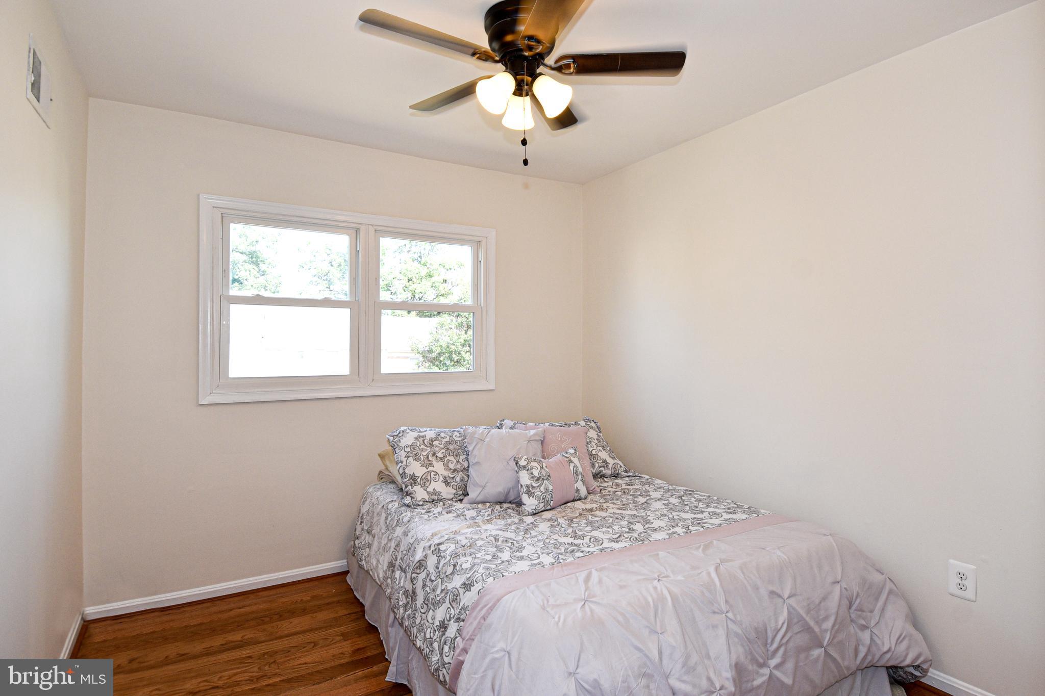 8482 Stonewall Road Manassas, VA 20110 - Photo 23 of 36 Bedroom with hardwood, Fits a Full size