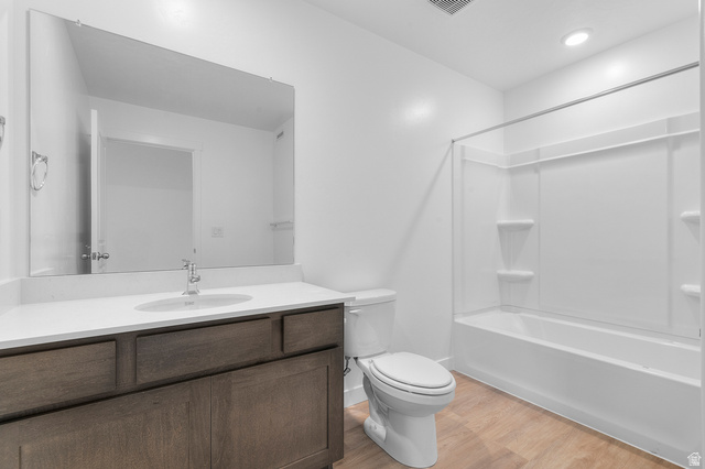 2829 South 710th West, Unit 17 Logan, UT 84321 - Photo 18 of 22 Bathroom with vanity, light wood-style flooring, and tub / shower combination