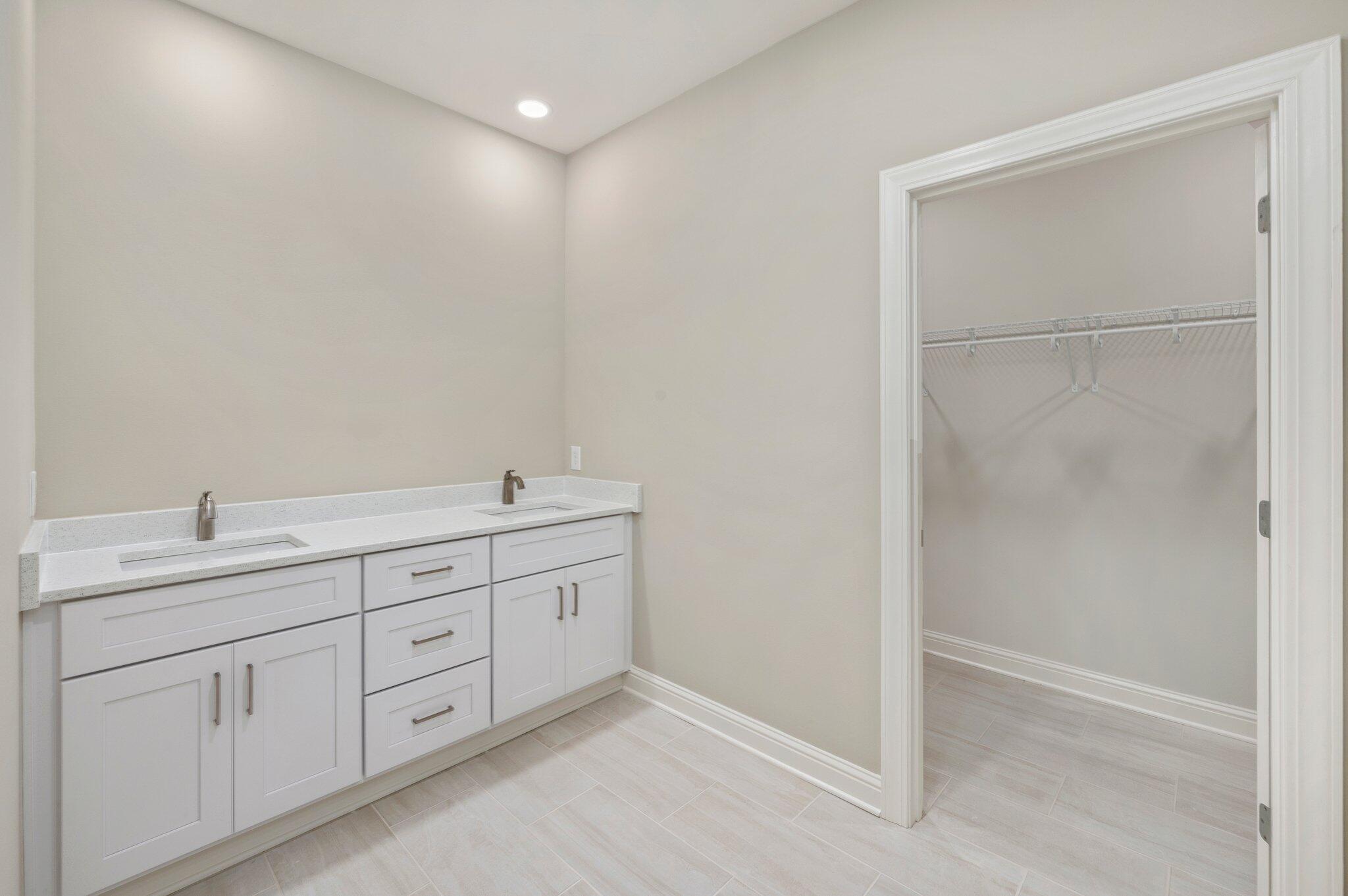 6043 Sand Hill Road Crestview, FL 32539 - Photo 20 of 36 a spacious bathroom with 2 sink and a mirror