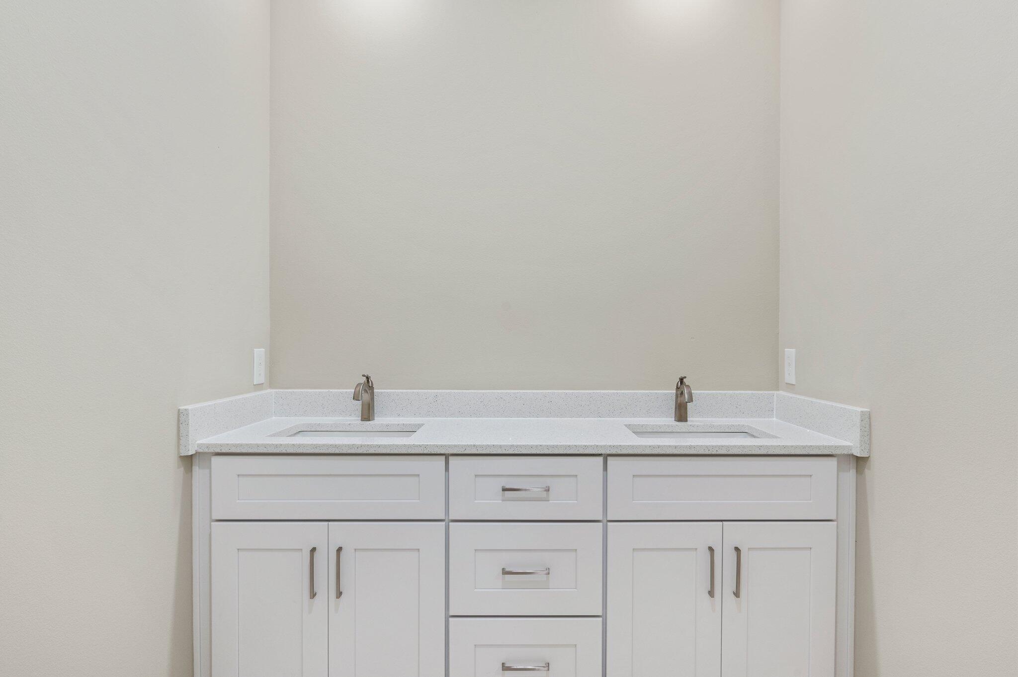 6043 Sand Hill Road Crestview, FL 32539 - Photo 21 of 36 a bathroom with a sink and a mirror