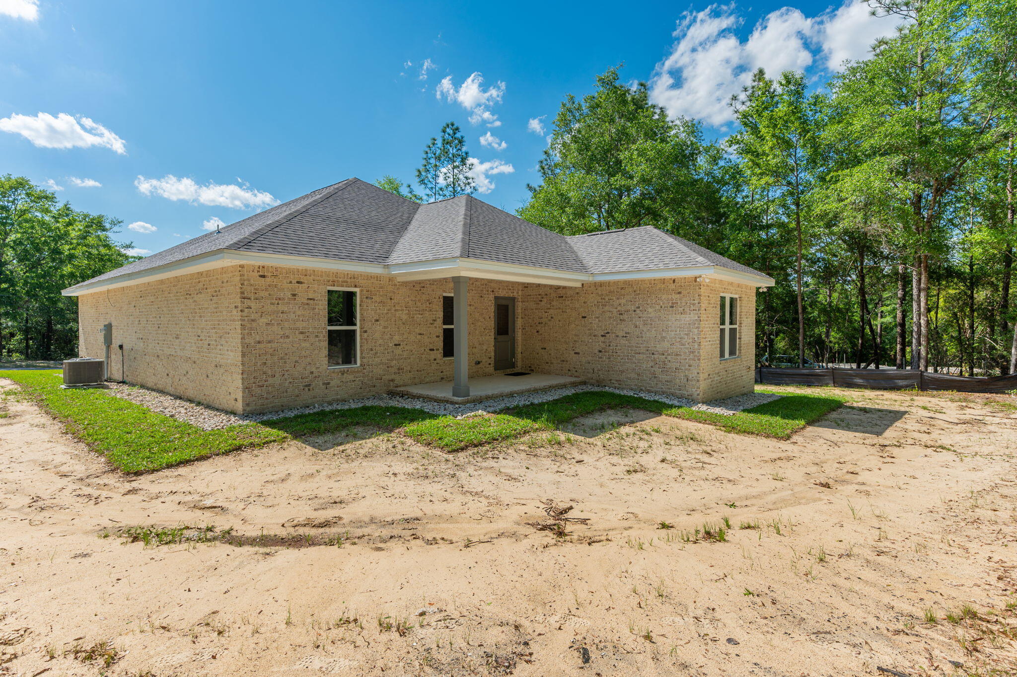 6043 Sand Hill Road Crestview, FL 32539 - Photo 33 of 36 a house with a yard