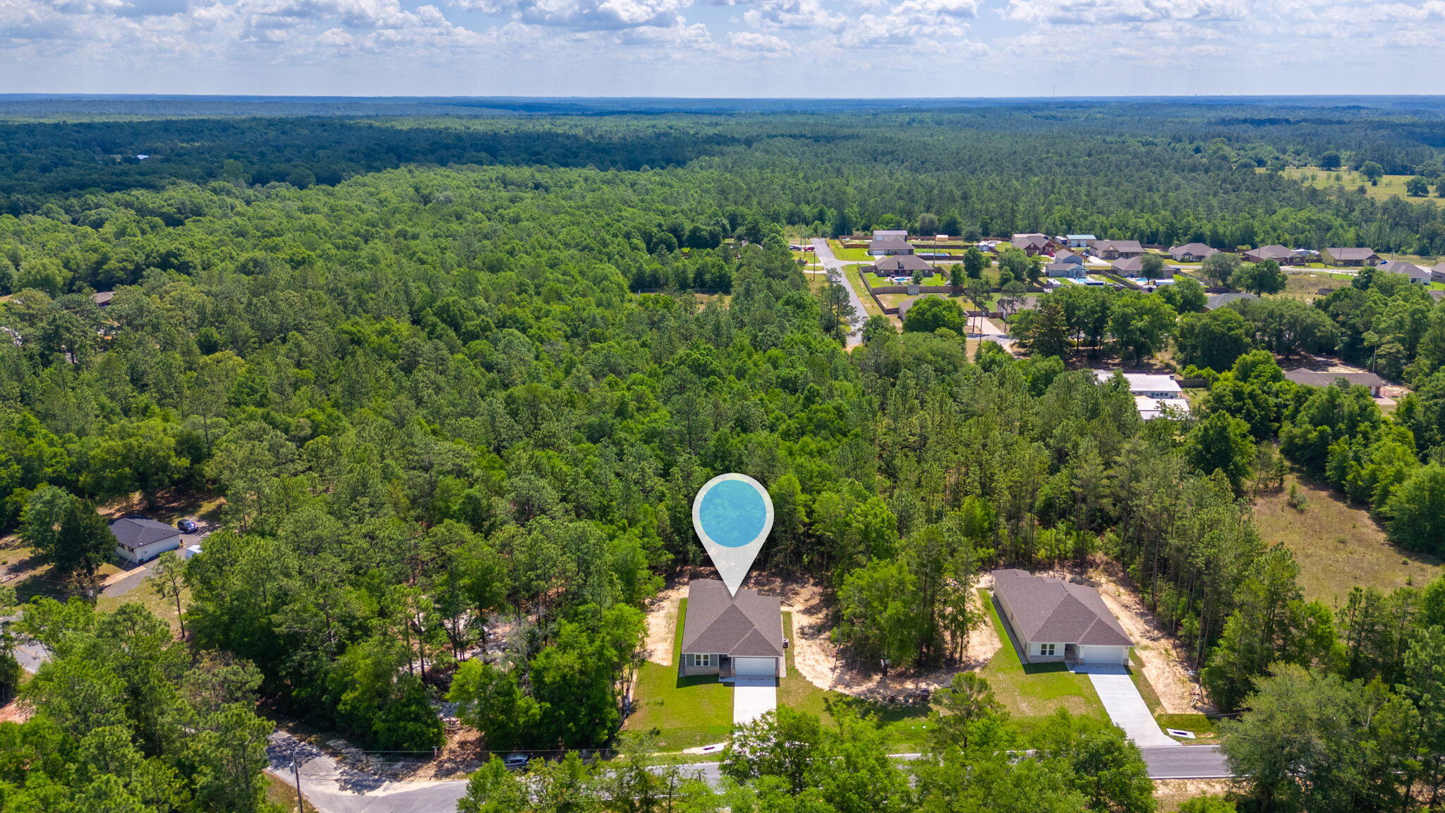 6043 Sand Hill Road Crestview, FL 32539 - Photo 35 of 36 an aerial view of a house with a yard and lake view