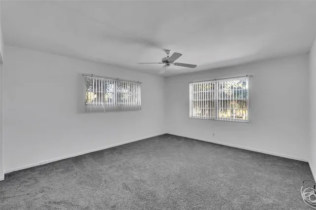 a view of an empty room with windows