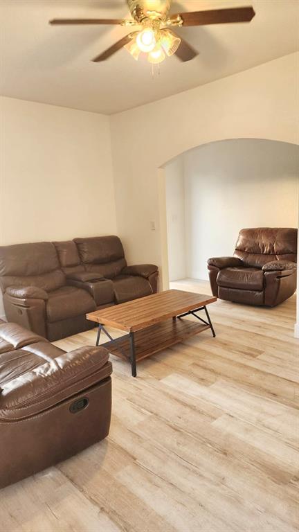 412 Bay Street Northwest Fort Meade, FL 33841 - Photo 4 of 14 a living room with furniture and a wooden floor