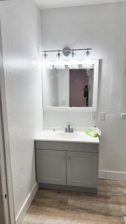 412 Bay Street Northwest Fort Meade, FL 33841 - Photo 6 of 14 a bathroom with a sink and a mirror