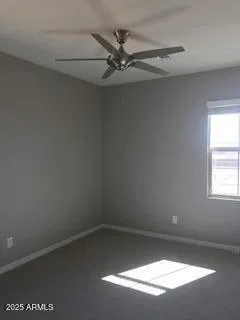 a view of a small space with wooden floor and a window
