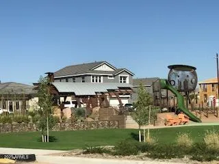 a view of multiple houses with a big yard