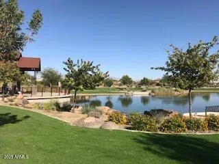 a view of a lake with a house in the background