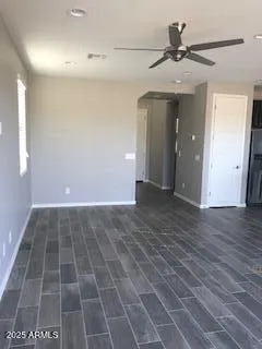 a view of an empty room and wooden floor