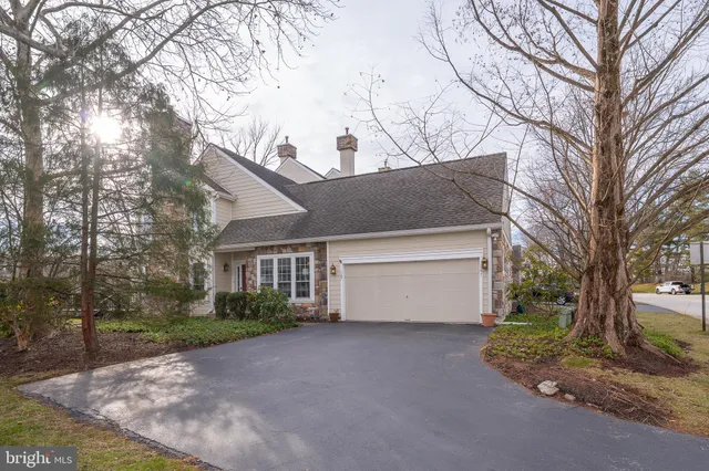 a view of a house with a yard and garage
