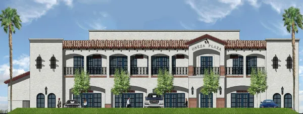 a front view of a residential apartment building with a yard