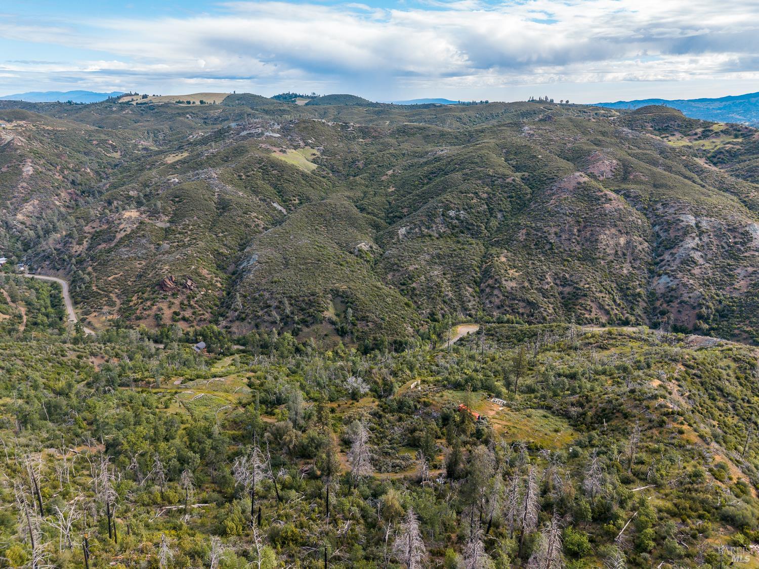 14515 Big Canyon Road Middletown, CA 95461 - Photo 14 of 23 a view of a city with lush green forest