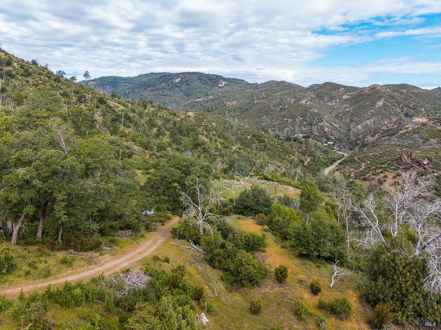 14515 Big Canyon Road Middletown, CA 95461 - Photo 7 of 23 a view of a mountain range with lush green forest