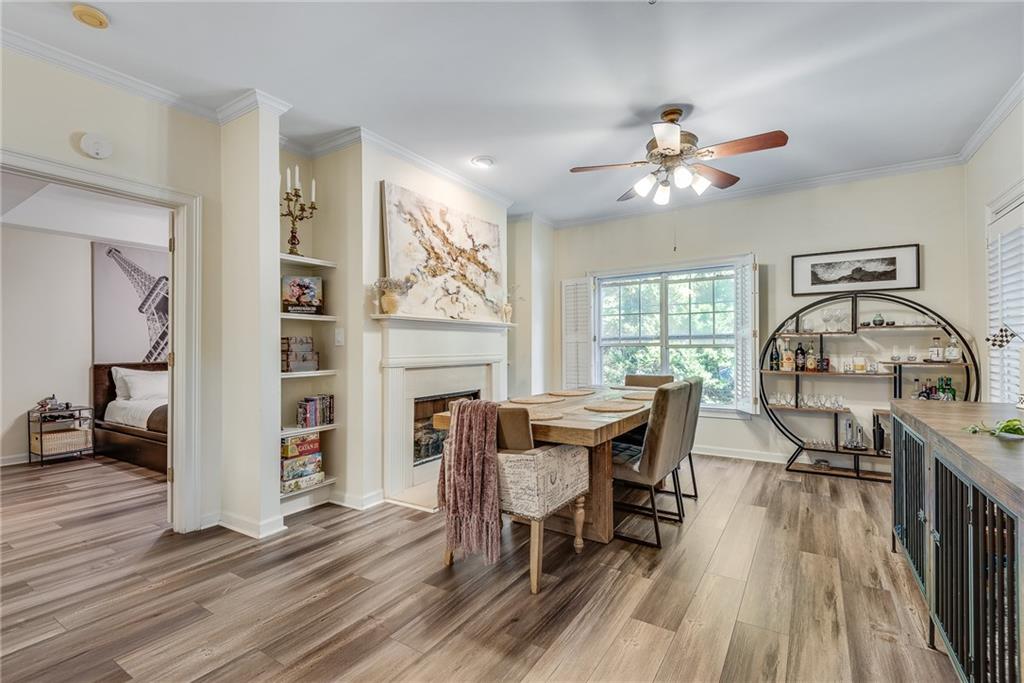 3275 Lenox Road Northeast, Unit 108 Atlanta, GA 30324 - Photo 3 of 22 a view of a dining room with furniture window and wooden floor