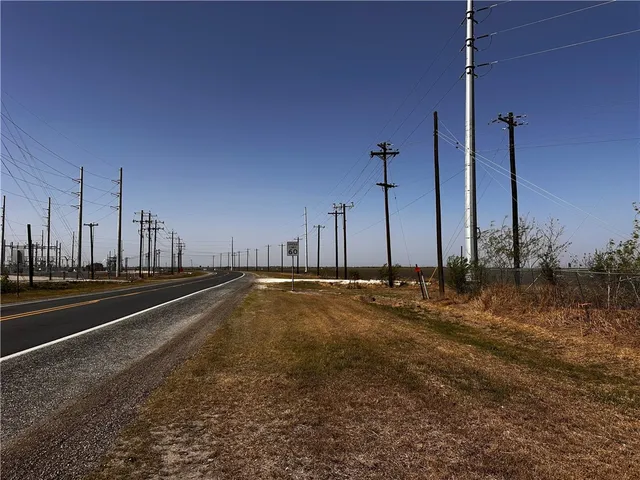 a view of a swimming pool with a yard