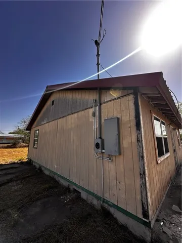 a view of a back yard of the house
