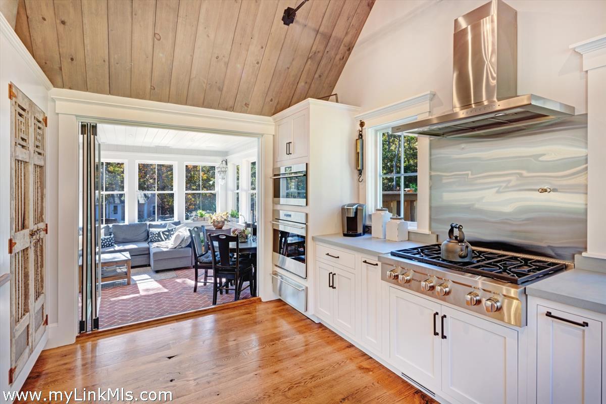 27 Clambelly Road Chilmark, MA 02535 - Photo 12 of 39 a kitchen with stainless steel appliances granite countertop a stove and cabinets