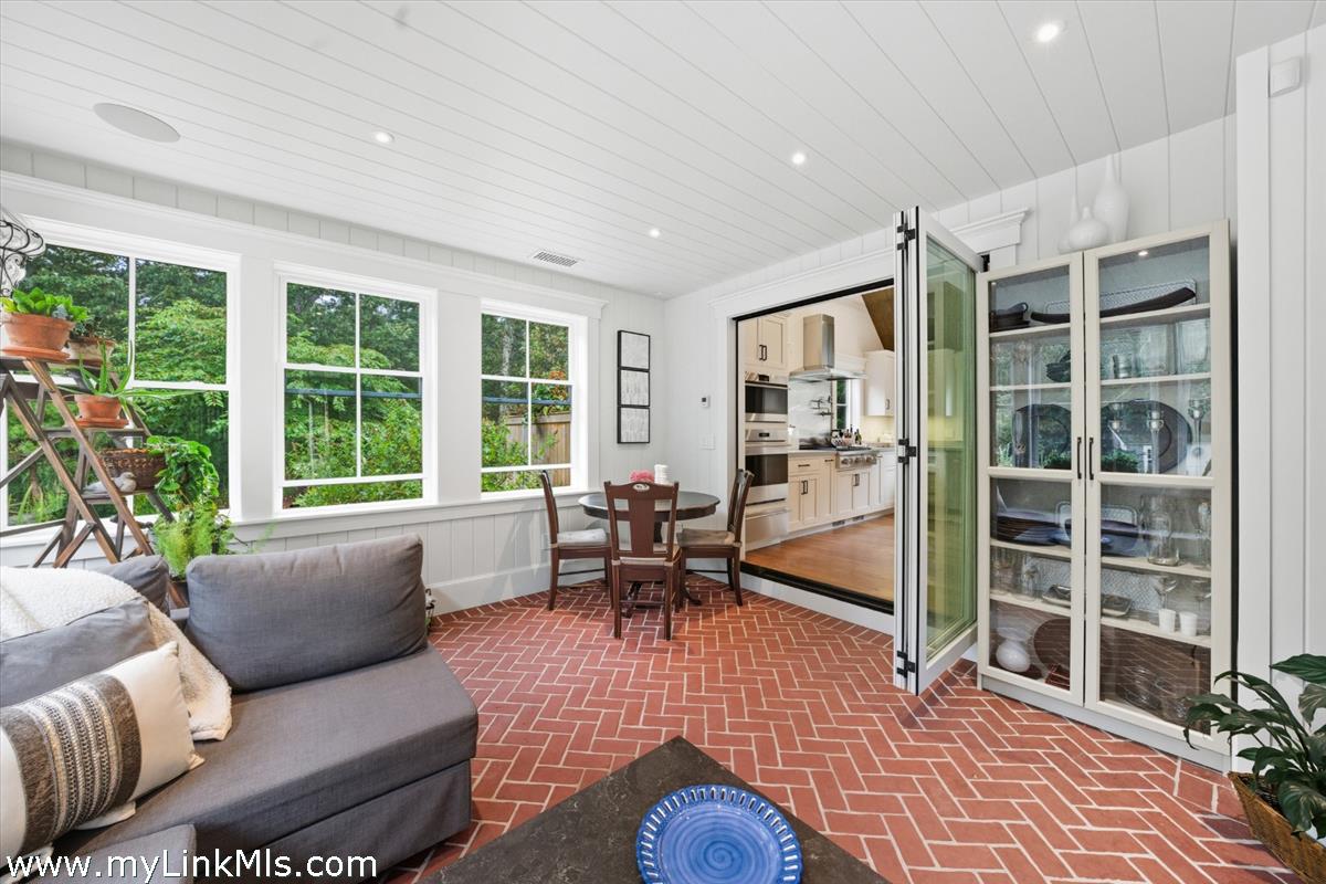 27 Clambelly Road Chilmark, MA 02535 - Photo 14 of 39 a living room with furniture floor to ceiling window and wooden floor