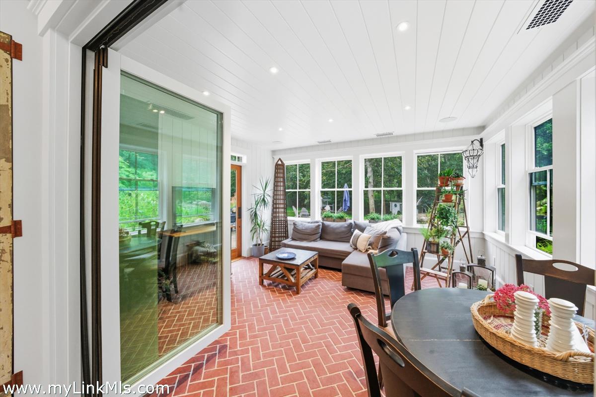 27 Clambelly Road Chilmark, MA 02535 - Photo 15 of 39 a living room with furniture and a large window