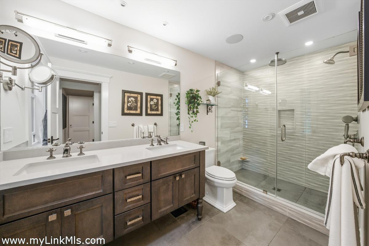 27 Clambelly Road Chilmark, MA 02535 - Photo 18 of 39 a bathroom with a double vanity sink toilet and shower