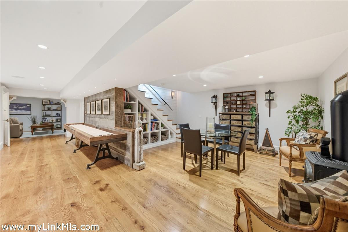 27 Clambelly Road Chilmark, MA 02535 - Photo 28 of 39 a living room with furniture and a wooden floor