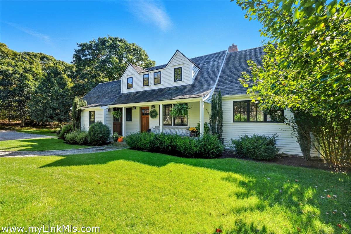 27 Clambelly Road Chilmark, MA 02535 - Photo 3 of 39 a view of a brick house with a big yard plants and large trees