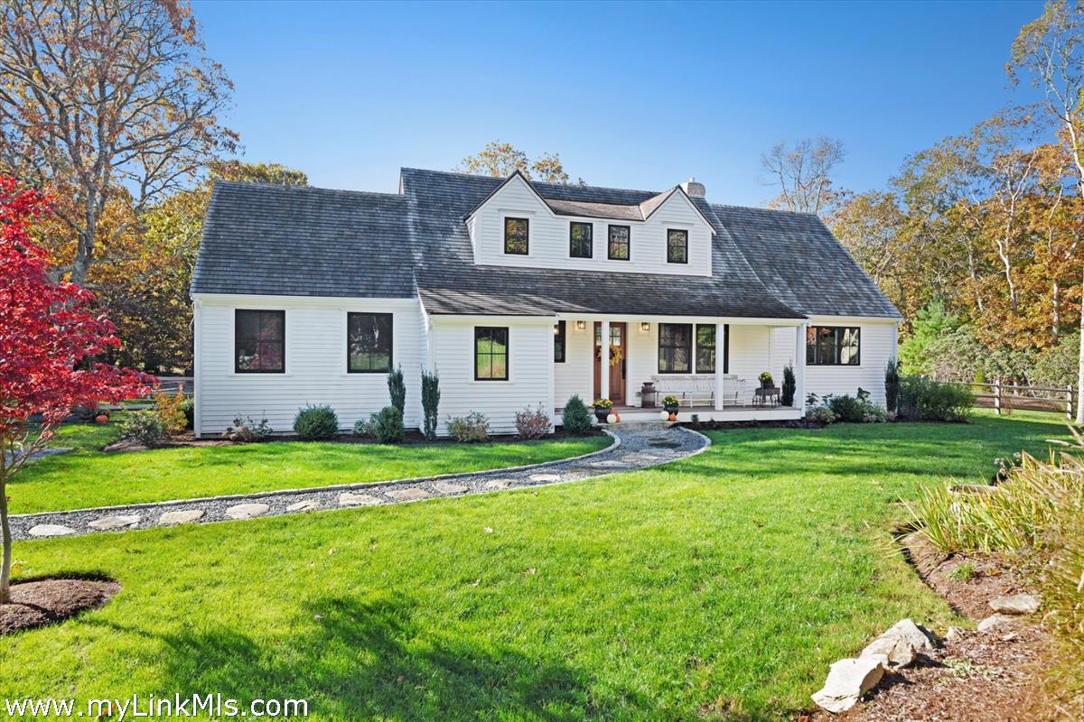 27 Clambelly Road Chilmark, MA 02535 - Photo 39 of 39 a front view of a house with a garden and trees