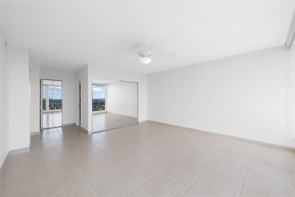 4280 Galt Ocean Drive, Unit 25C Fort Lauderdale, FL 33308 - Photo 13 of 55 an empty room with windows and entrance