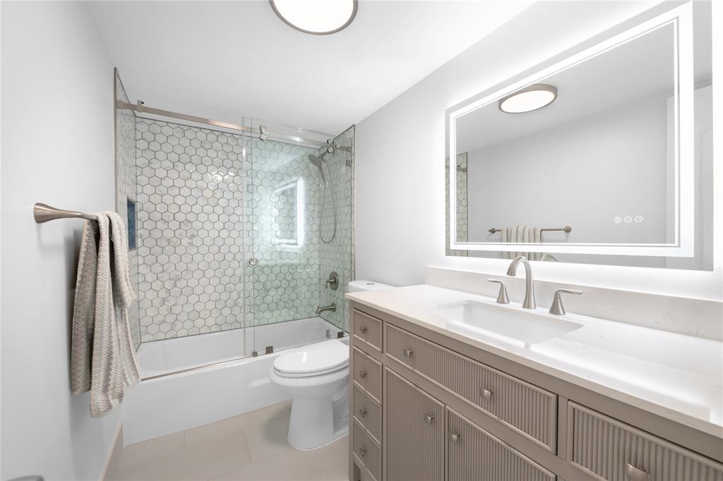 4280 Galt Ocean Drive, Unit 25C Fort Lauderdale, FL 33308 - Photo 20 of 55 a bathroom with a sink a toilet and shower