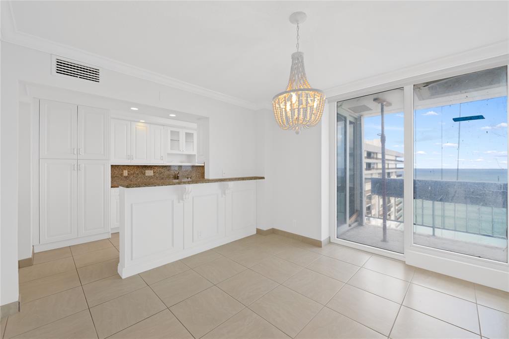 4280 Galt Ocean Drive, Unit 25C Fort Lauderdale, FL 33308 - Photo 9 of 55 a view of kitchen with refrigerator and window